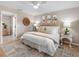 Cozy bedroom featuring neutral tones, a comfortable bed, and a ceiling fan at 12920 124Th Ave, Largo, FL 33774