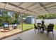 Enjoy the outdoors under this covered patio, with dining and lounge areas, plus a fire pit at 12920 124Th Ave, Largo, FL 33774