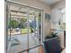 Covered patio featuring an outdoor kitchen and a view of the landscaped backyard at 12920 124Th Ave, Largo, FL 33774
