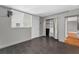 Bedroom boasts a window, wood-look tile floors, and a closet to the right, open door to the hallway at 1301 S Howard Ave # A22, Tampa, FL 33606