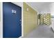 Condominium doorway with the unit number, positioned in an outdoor hallway at 1301 S Howard Ave # A22, Tampa, FL 33606