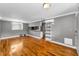 Inviting living room featuring hardwood floors, with natural light filtering through the windows near breakfast bar and storage shelves at 1301 S Howard Ave # A22, Tampa, FL 33606