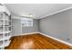 Cozy room featuring hardwood floors, white shelving and bright window at 1301 S Howard Ave # A22, Tampa, FL 33606