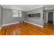 Well-lit living room with hardwood floors, a breakfast bar, and a large window, creating a welcoming space at 1301 S Howard Ave # A22, Tampa, FL 33606