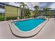 Beautiful community pool with clear blue water and a concrete deck at 1301 S Howard Ave # A22, Tampa, FL 33606