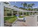 Relaxing pool area with lounge chairs and a white trellis walkway at 1301 S Howard Ave # A22, Tampa, FL 33606