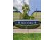 Eye-level view of the 1301 SoHo Condominiums signage surrounded by hedges at 1301 S Howard Ave # A22, Tampa, FL 33606