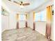Cozy bedroom with ample natural light, wood-look floors, and modern window treatments, creating a relaxing atmosphere at 13928 Raie Ave, Hudson, FL 34667