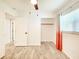 Bedroom with laminate flooring, closet, and neutral color scheme, creating a relaxing atmosphere at 13928 Raie Ave, Hudson, FL 34667