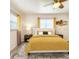 Comfortable bedroom with a ceiling fan, large windows, a comfortable bed, and matching furniture at 13928 Raie Ave, Hudson, FL 34667