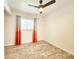 Bright bedroom featuring hardwood-style floors, a ceiling fan, and ample natural light at 13928 Raie Ave, Hudson, FL 34667