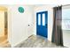 Inviting entryway featuring stylish tile flooring, a modern front door, and ample natural light at 13928 Raie Ave, Hudson, FL 34667