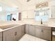 Updated kitchen featuring modern countertops, ample cabinet space, and an open design for easy entertaining at 13928 Raie Ave, Hudson, FL 34667