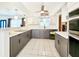 Contemporary kitchen featuring sleek countertops, ample storage, and stainless steel appliances for a modern touch at 13928 Raie Ave, Hudson, FL 34667