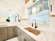 Stylish kitchen with modern finishes, including a new sink, countertops, and updated cabinetry for a fresh look at 13928 Raie Ave, Hudson, FL 34667
