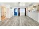 Bright living room boasting new flooring and an open layout, perfect for modern living and entertaining at 13928 Raie Ave, Hudson, FL 34667