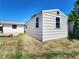 Exterior view of a metal shed in the backyard, offering additional storage space on the property at 13928 Raie Ave, Hudson, FL 34667