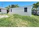 View of utility shed in overgrown backyard at 13928 Raie Ave, Hudson, FL 34667
