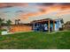Private backyard with a spacious wooden deck, perfect for outdoor entertaining at 13978 Barbados Dr, Seminole, FL 33776