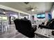 Bright living room with hardwood floors, comfortable seating, and an open layout at 13978 Barbados Dr, Seminole, FL 33776