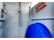 The is an outdoor shower area with blue walls, a shower, and a mirror at 13978 Barbados Dr, Seminole, FL 33776