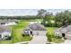 Community view of the house with a pond and green surroundings at 14063 Wineberry Dr, Dade City, FL 33525
