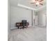 Bright bedroom offers a ceiling fan, a desk, and neutral walls and plush carpet at 14063 Wineberry Dr, Dade City, FL 33525