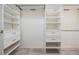 Walk-in closet features custom shelves, drawers, and ample storage space at 14063 Wineberry Dr, Dade City, FL 33525