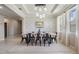 Elegant dining room featuring modern lighting, neutral tones, and ample seating; perfect for hosting at 14063 Wineberry Dr, Dade City, FL 33525