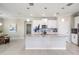 Open kitchen featuring a large island with pendant lighting, granite countertops and modern appliances at 14063 Wineberry Dr, Dade City, FL 33525