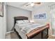 Comfortable bedroom featuring a large bed, ceiling fan, neutral color scheme, and cozy ambiance at 14206 Covert Green Pl, Riverview, FL 33579