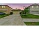 Charming single-Gathering home with a well-maintained lawn and a two-car garage at 14206 Covert Green Pl, Riverview, FL 33579