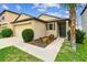 Inviting single-Gathering home featuring lush landscaping, a tidy lawn and a two-car garage at 14206 Covert Green Pl, Riverview, FL 33579