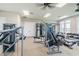 Fully-equipped fitness center featuring a variety of machines and free weights for diverse workout routines at 14206 Covert Green Pl, Riverview, FL 33579
