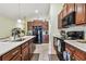 Bright kitchen features sleek appliances, lots of counter space, and stylish tile flooring at 14206 Covert Green Pl, Riverview, FL 33579
