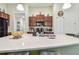 Large kitchen island features a modern faucet and counter space, perfect for meal prep at 14206 Covert Green Pl, Riverview, FL 33579