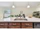 Kitchen island with sink and modern faucet, providing functionality and style at 14206 Covert Green Pl, Riverview, FL 33579