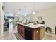 Open kitchen with a center island, modern appliances, and seamless flow to the living spaces at 14206 Covert Green Pl, Riverview, FL 33579