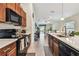 Kitchen features stainless steel appliances, ample counter space, and an open design at 14206 Covert Green Pl, Riverview, FL 33579