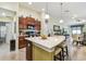 Open concept kitchen with island, modern appliances, breakfast bar and adjacent dining area at 14206 Covert Green Pl, Riverview, FL 33579