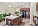 Spacious kitchen showcases a large center island, modern appliances, and ample storage at 14206 Covert Green Pl, Riverview, FL 33579