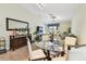 Bright living room with tile floors, a glass table, and plenty of natural light at 14206 Covert Green Pl, Riverview, FL 33579