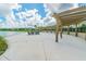 The community pergola provides a perfect spot for relaxation with its stunning lake views and comfortable seating at 14206 Covert Green Pl, Riverview, FL 33579