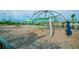 A playground with slides and a climbing web provides children with a variety of entertainment at 14206 Covert Green Pl, Riverview, FL 33579