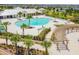 Aerial view of community pool with lounge chairs and clubhouse at 14206 Covert Green Pl, Riverview, FL 33579