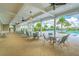 Inviting poolside patio with ample seating, providing a relaxing space to enjoy the outdoor amenities at 14206 Covert Green Pl, Riverview, FL 33579