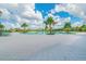 Expansive community swimming pool surrounded by lush landscaping and lounge chairs for relaxation at 14206 Covert Green Pl, Riverview, FL 33579