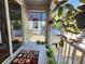Relaxing balcony decorated with potted plants, an area rug, and providing ample sunlight at 1427 Hillview Ln, Tarpon Springs, FL 34689