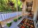 Relaxing balcony decorated with potted plants, an area rug, and providing ample sunlight at 1427 Hillview Ln, Tarpon Springs, FL 34689