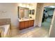 Bathroom with double sinks, and a walk-in closet at 1427 Hillview Ln, Tarpon Springs, FL 34689